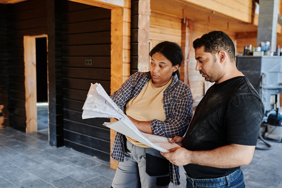 Contractor reviewing kitchen blueprints